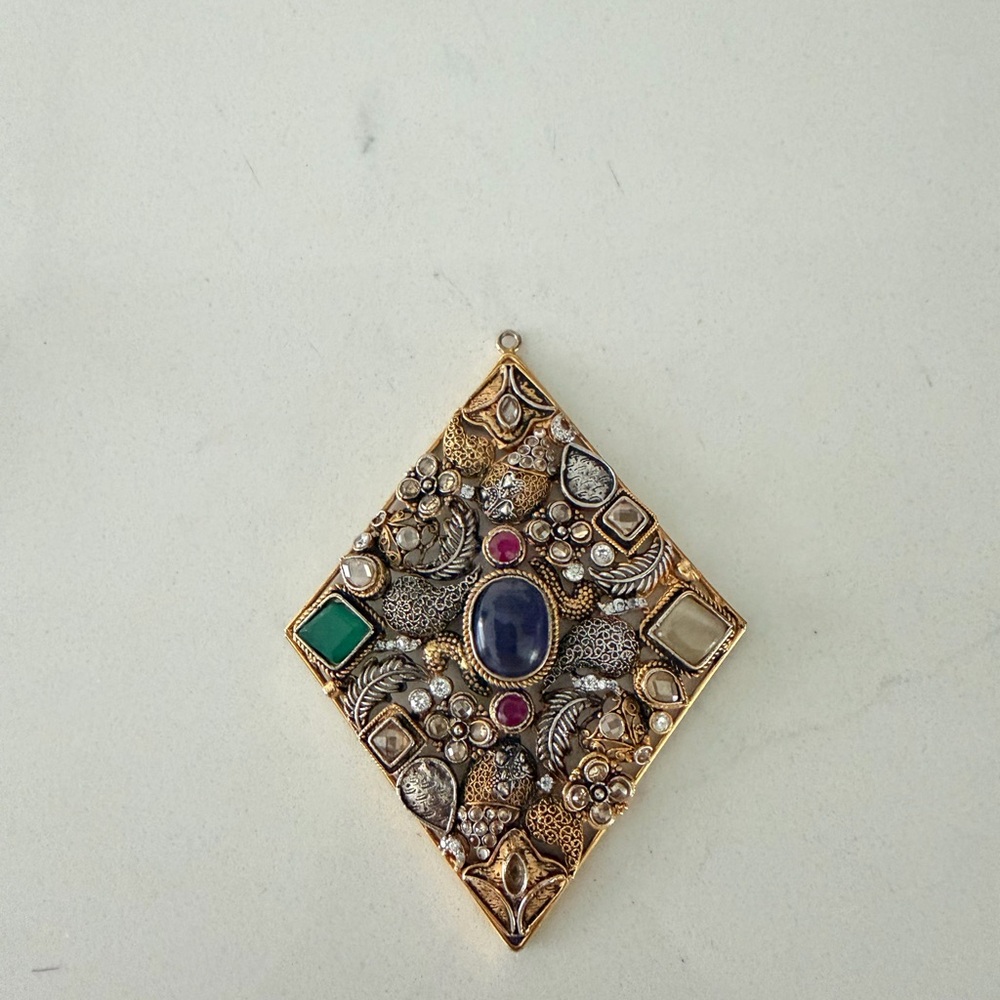 Elegant Gold and Silver Pendant with Gem Accents